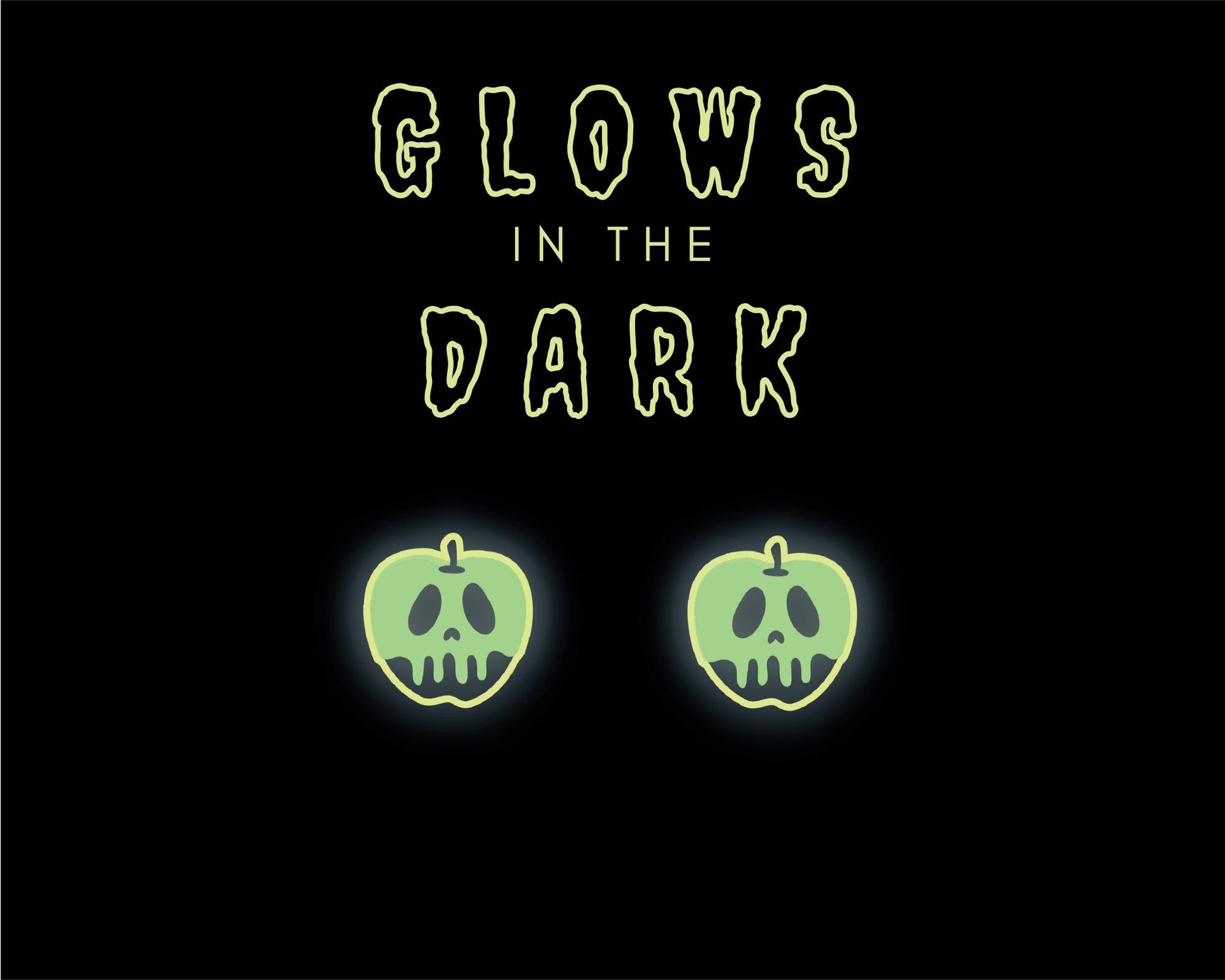 two green apples with skull faces, glowing in the dark against a black background.